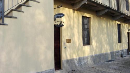 a building with a door and a light on it at Cascina Scanna in Cisliano