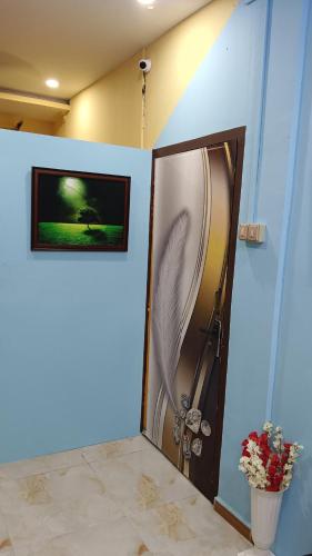 Ένα ή περισσότερα κρεβάτια σε δωμάτιο στο Balaji Lodge