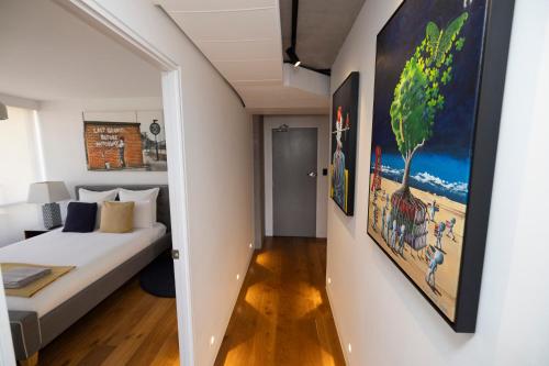 a bedroom with a bed and a painting on the wall at Panoramic City Views! - Large Luxury 2 Bedroom Apartment in Brisbane