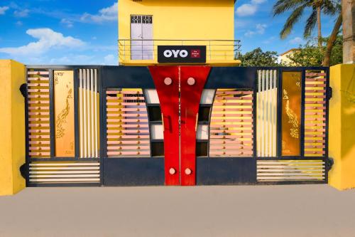 a building with a colorful front with the ovy sign on it at Hotel O The Shivansh Inn in Cuttack