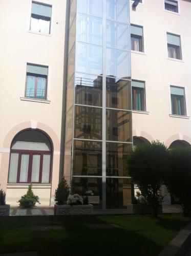 a glass facade of a building at Hotel Casa Del Pellegrino in Padova