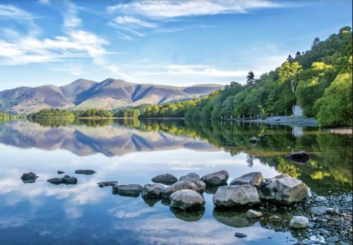 a view of a lake with mountains in the background at Eagles Cottage, 3 - Bed, Sleeps 6, Pets Welcome - Ulverston in Ulverston