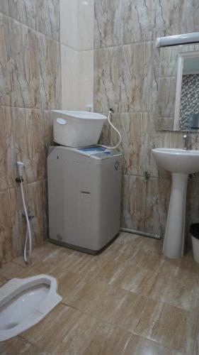 Ein Badezimmer in der Unterkunft Diyar Villas Puncak F4/8