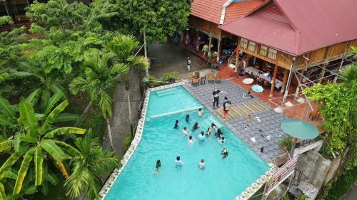 an overhead view of people in a swimming pool at Mai Chau Sunset Boutique Hotel in Mai Chau