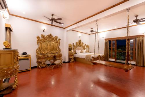 a bedroom with a bed and a swing at La Moon Puducherry in Puducherry