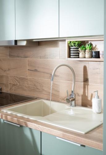 a kitchen sink with a faucet at Kalamaki-Sunset - Scenic Sunset & Sea Views - Steps from Shore! in Kalamaki Heraklion