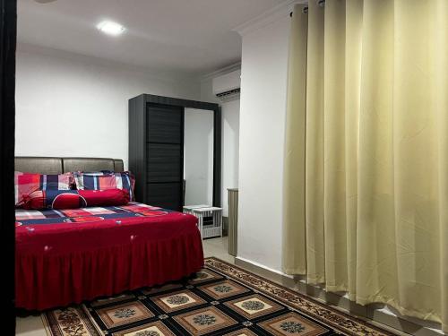 Katil atau katil-katil dalam bilik di Homestay Mambau MALAY ONLY