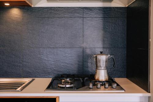 a blender sitting on top of a stove in a kitchen at Parrys Estate at Parry Beach in Parryville