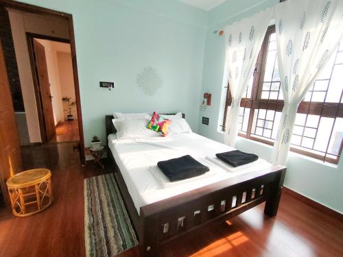 Postel nebo postele na pokoji v ubytování Tranquil Traditions Homestay - Inspired by Nature & Heritage