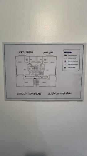 a picture of an evacuation plan in a refrigerator at XD Cozy Apartments in Abu Dhabi