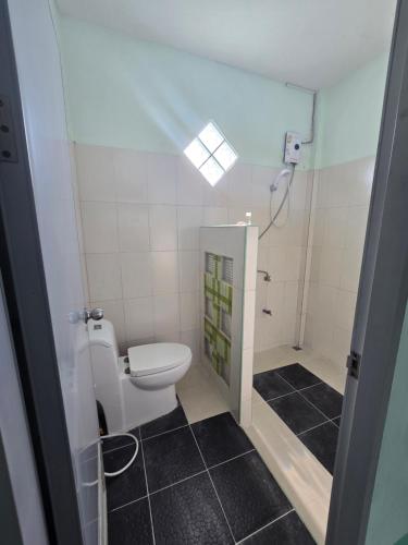 a bathroom with a toilet and a shower at pasak house1 in Ban Nong Chaeng