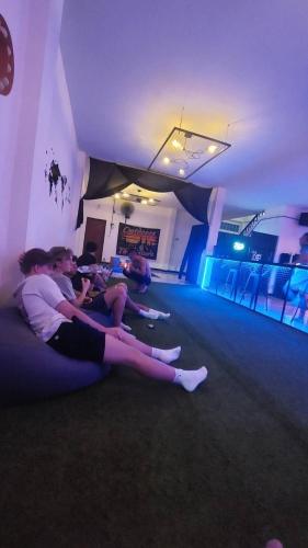 a group of people laying on the floor in a room at Outback Hostel & Community in Pai