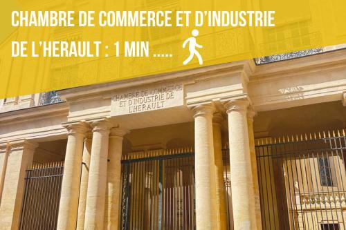 a building with a sign on the side of it at SYLOU - Centre historique, 4 personnes, Climatisation, Netflix, Comédie, Tramway, Gare in Montpellier