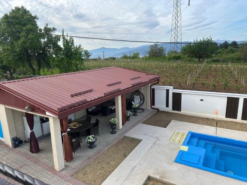 a house with a swimming pool and a roof at Villa Veronika in Skopje