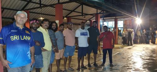 a group of men are standing in a group at Beyond Nomad Luxury Hostel in Ella