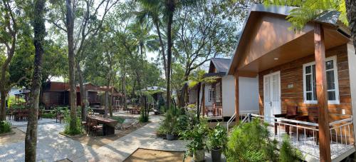 a house in the middle of a forest at Bungalow Kim Long, Huế in Thôn Dương Xuân Hạ