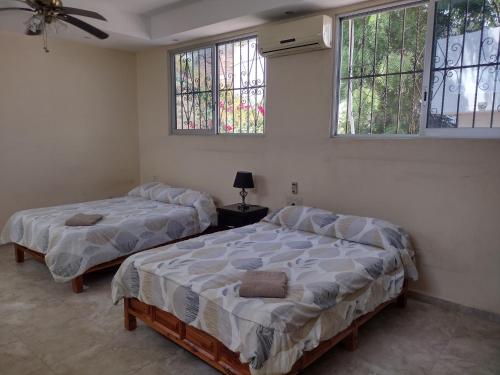 Katil atau katil-katil dalam bilik di Casa Kleha Familiar y Comodidad