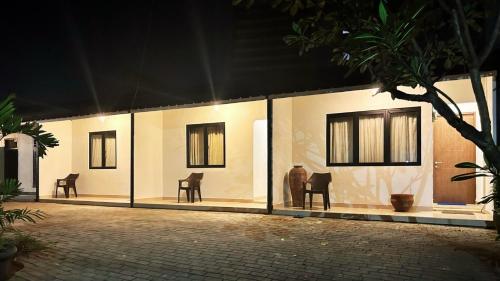 a group of chairs sitting outside of a building at The Segaran House ONLY Syariah Unmarried Couple Not Allowed in Jakarta
