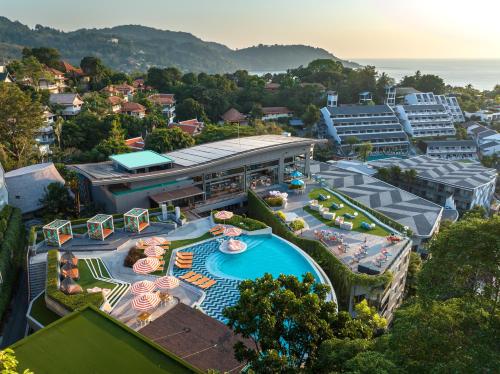 an aerial view of a resort with a swimming pool at The SIS Kata Resort - Adult Only in Kata Beach