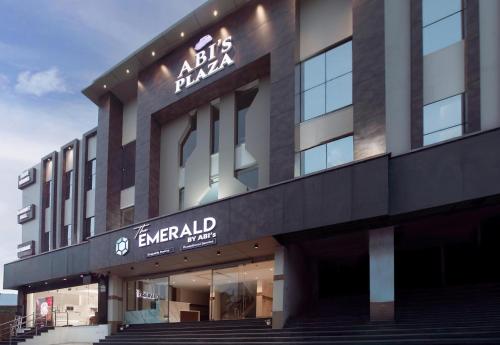 a building with a sign on the front of it at The Emerald in Thanjāvūr