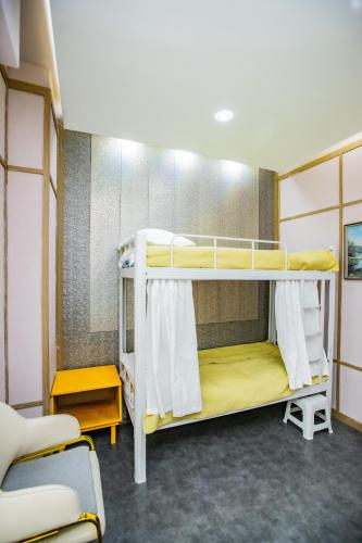 a bunk bed room with two bunk beds in it at Elite Guest House in the heart of Downtown Ulaanbaatar in Ulaanbaatar