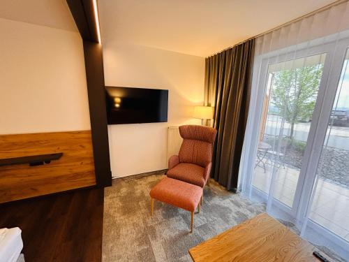 TV a/nebo společenská místnost v ubytování Landgasthof Deutsches Haus KG