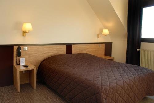 Posteľ alebo postele v izbe v ubytovaní Sud Hotel