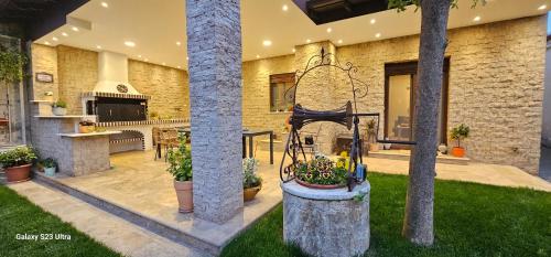 a house with a garden with a fountain in the yard at Garden's House Pozar in Aridaia in Aridaia