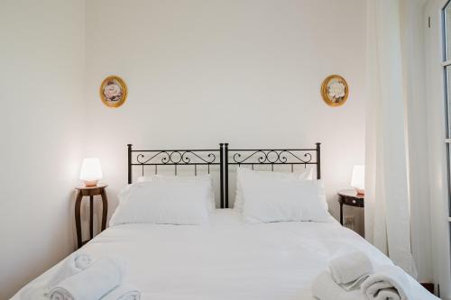 Ένα ή περισσότερα κρεβάτια σε δωμάτιο στο Villa Vittoria