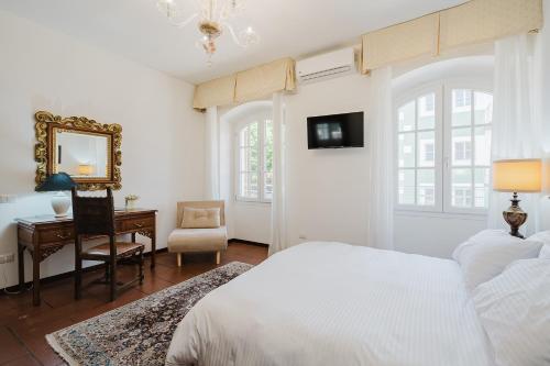 Ένα ή περισσότερα κρεβάτια σε δωμάτιο στο Villa Vittoria
