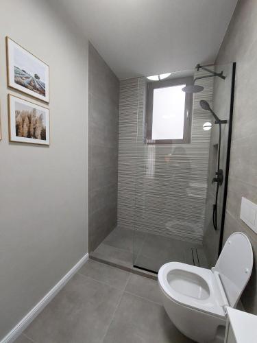 Koupelna v ubytování VIMANIS aparthotel