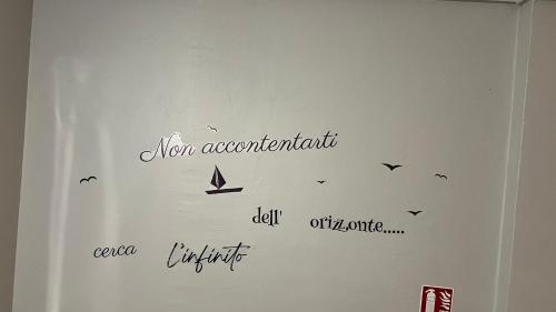 a white wall with writing on the side of it at Le Signoret in Sault-de-Vaucluse