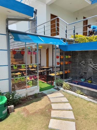 a building with a balcony with a lot of shoes at DIAMOND HILL VIEW in Ketti