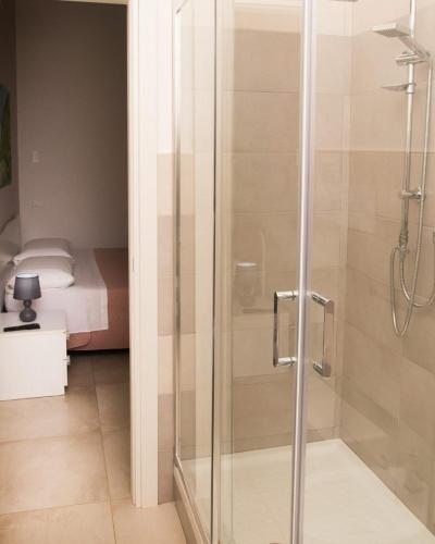 a shower with a glass door in a bathroom at La Bella Salernitana in Salerno
