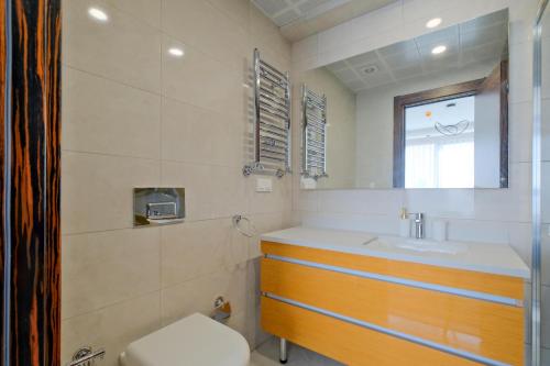 a bathroom with a sink and a toilet at Modern Furnished Apartments in Istanbul Basaksehir By Iradah Gayrimenkul in Basaksehir