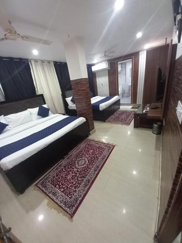 Ένα ή περισσότερα κρεβάτια σε δωμάτιο στο Hotel Vaishali