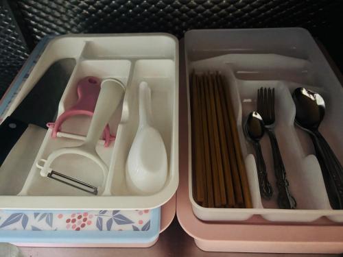 a plastic lunch box with utensils in it at 富良野 星野家 in Furano