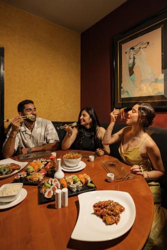 a group of people sitting around a table eating food at Sonesta Hotel Tower & Casino Cairo in Cairo