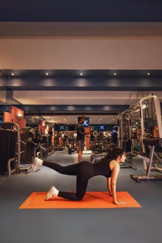 a woman doing a push up in a gym at Sonesta Hotel Tower & Casino Cairo in Cairo