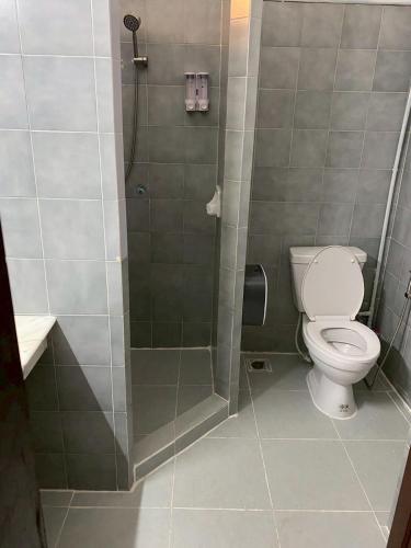 a bathroom with a toilet and a shower at AT ASok Vintage House Near BTS Asok MRT Sukhumvit in Klong Toi