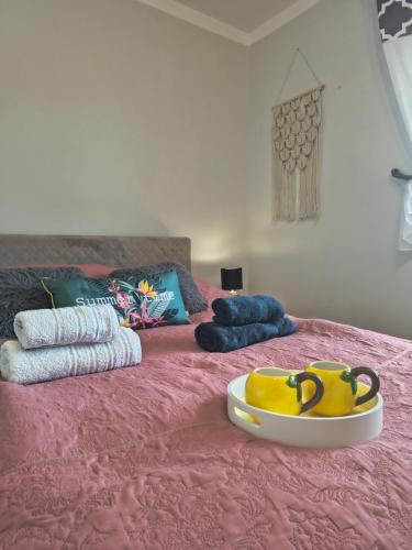 a pink bed with a toy on top of it at DOM w JESIONACH Brajniki - działka 1 HEKTAR in Jedwabno