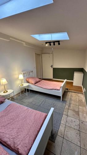 a bedroom with two beds and a blue ceiling at Nahe Innenstadt U-Bahn Alster in Hamburg