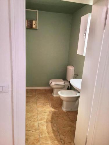 a bathroom with a toilet and a sink at Villa Liberty GHIRADA 1924 in Treviso