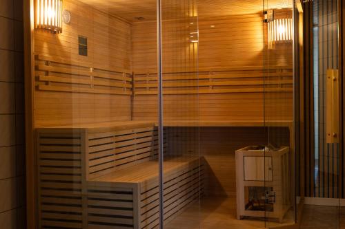 a sauna with a bench in a room at Hotel Winterberg Resort in Winterberg