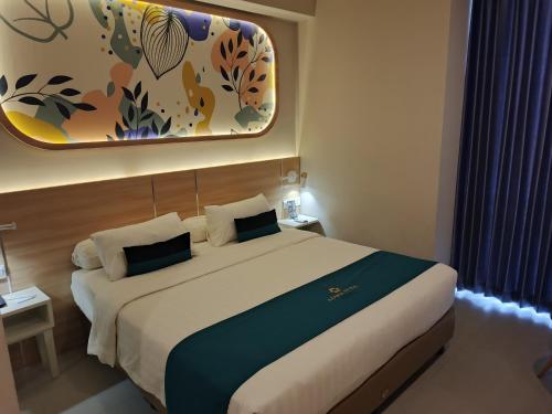 Ένα ή περισσότερα κρεβάτια σε δωμάτιο στο Azana Style Hotel Tulungagung