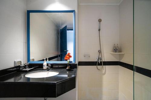 a bathroom with a sink and a mirror at Phuket Island View Resort - SHA Extra Plus in Karon Beach
