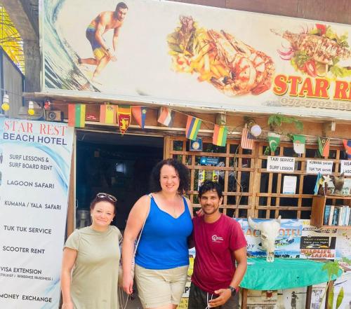 a group of people standing in front of a food truck at Star Rest Beach Hotel in Arugam Bay