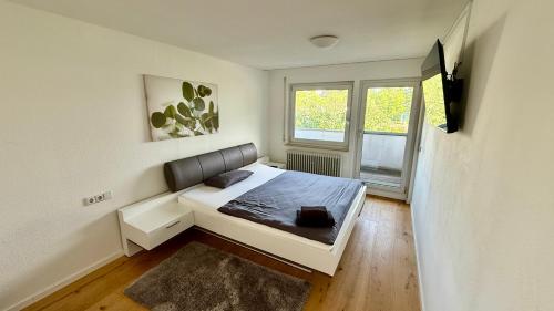 Postel nebo postele na pokoji v ubytování Ostalb Inn - Haus Bozica