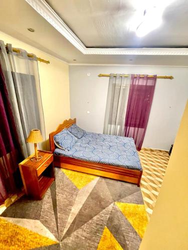 Postel nebo postele na pokoji v ubytování Auberge Mbongui