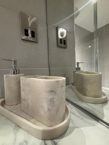a bathroom with two sinks on a counter at Beautiful, home from home, one bed stay in Olton